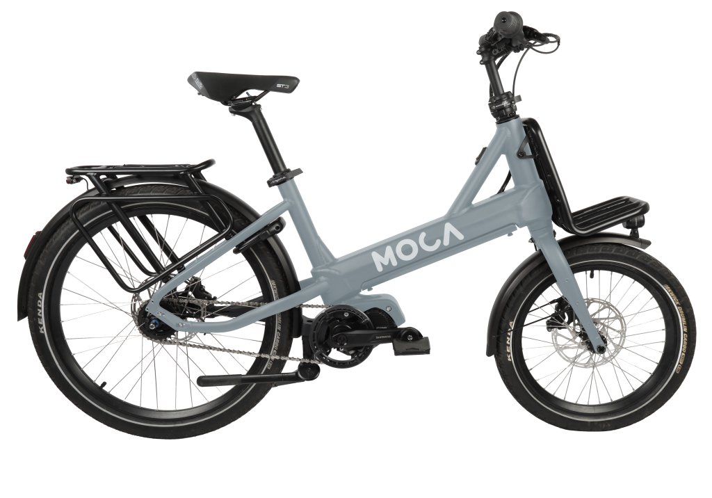 Freisteller eines grauen Fahrrades der Marke Moca, in der Seitenansicht.